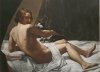 Young man with a cat on the bed
